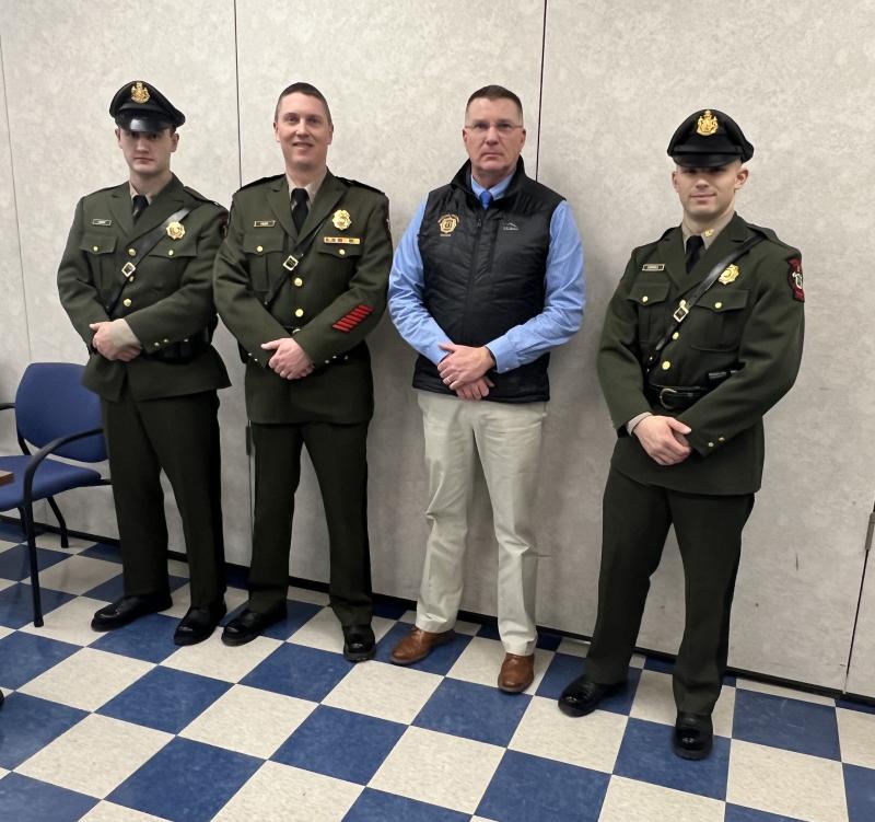 Pictured after recently graduating from the Maine Criminal Justice Academy are Callahan Crosby (left) and August Campbell (right) with Marine Patrol Colonel Matthew Talbot (2nd from left) and Department of Marine Resources Commissioner Patrick Keliher (2nd from right). (Photo courtesy Department of Marine Resources)