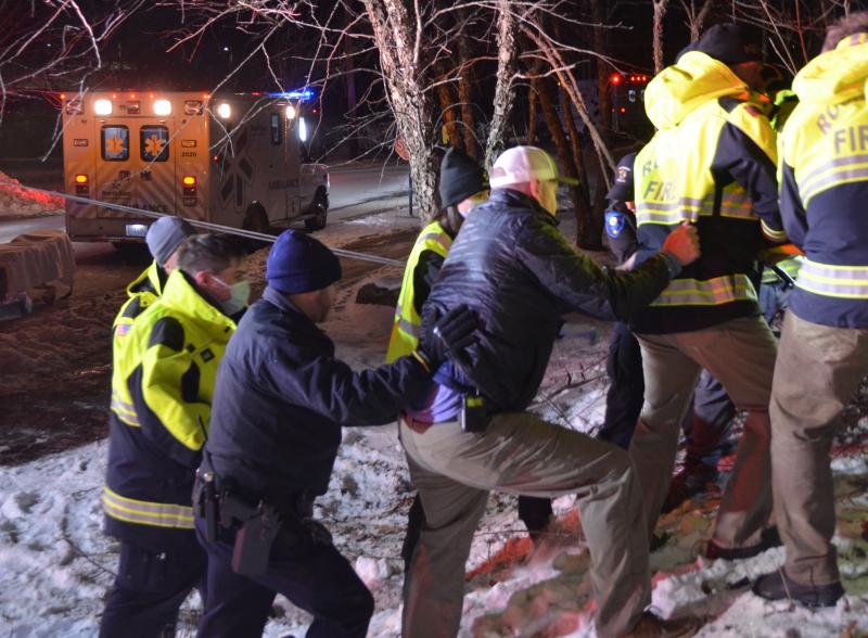 After a grueling hour of first stabilizing the Jeep and then working to safely extricate the driver, firefighters carefully loaded her onto a backboard and carried her to a waiting ambulance. (Photo by Lynda Clancy)