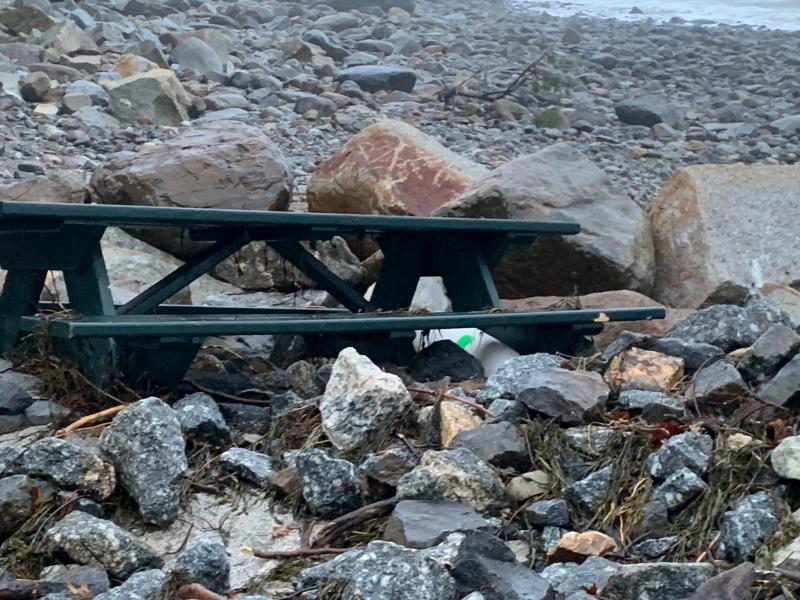 A picnic table has been partially buried in storm rubble at Steamboat Landing in Camden.