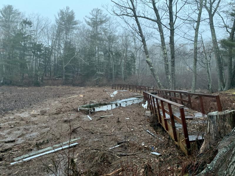 What initially looked like a boardwalk alongside the Camden Harbor is really a pier that washed onto land.