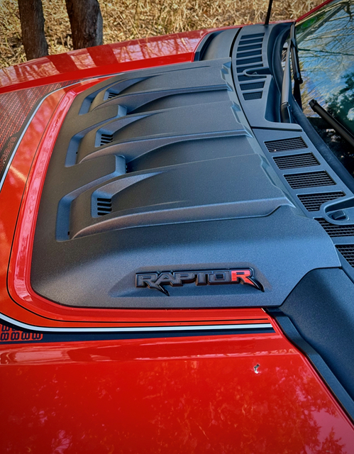 Although no Raptor is difficult to spot, particularly in fog-cutting orange, Ford has been decidedly low-key with the top-dog R model. Visual cues, such as this one on the hood’s heavy-duty heat extractor, are relatively scarce.