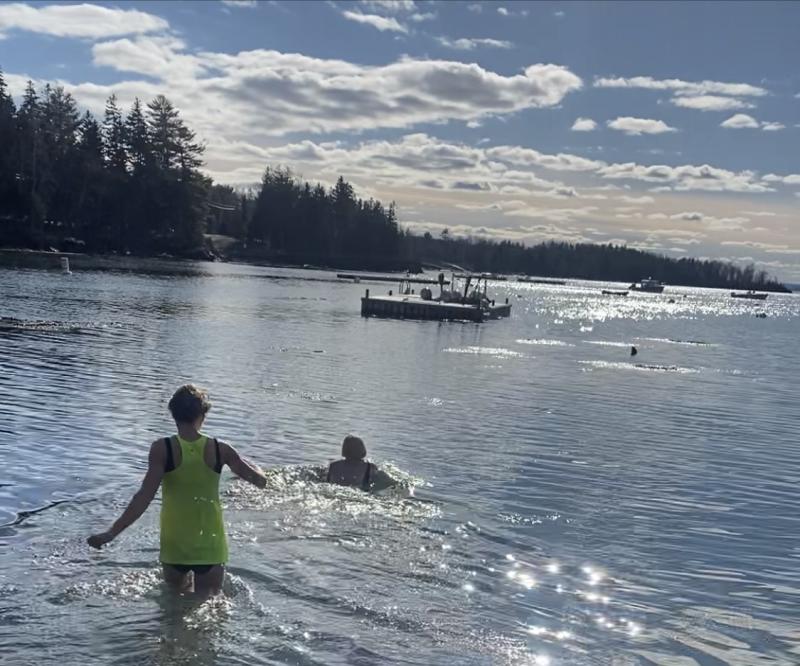 Betty Boucher and Rachel Earl of Freezing for Fun(ds) off of Big Tree Beach on Islesboro. (Photo courtesy Lisa Satchfield)