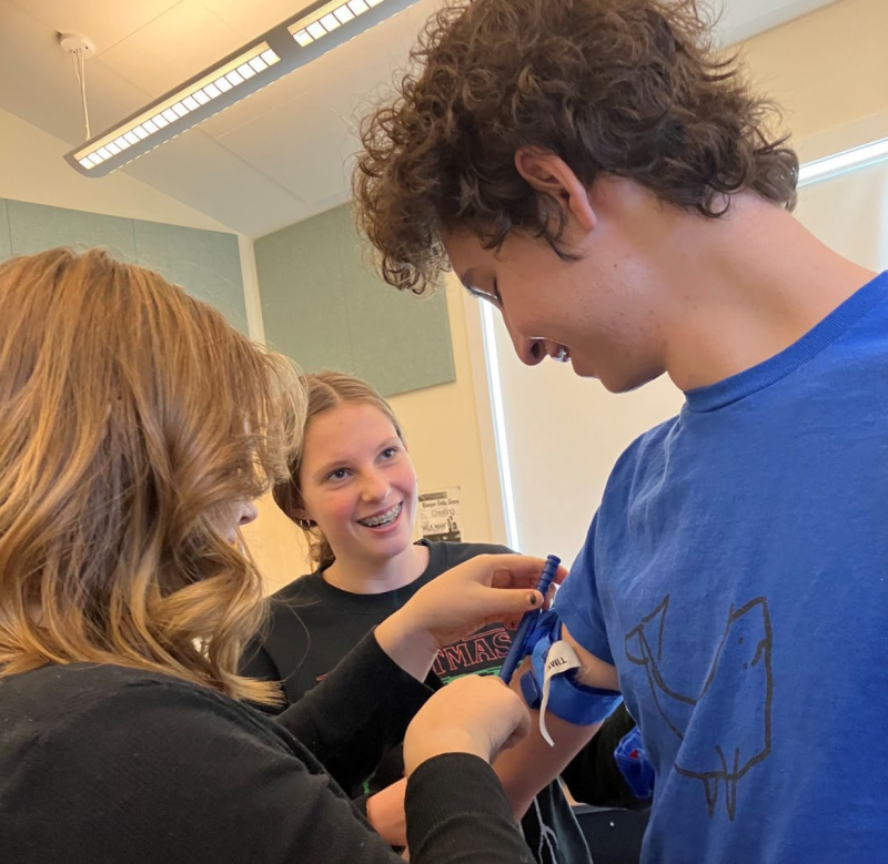 North Haven EMS Explorers practice applying a tourniquet during Stop-the-Bleed training, December 2023. (Photo courtesy North Haven EMS Explorers)