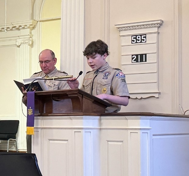 First Class Scout Zachary Mason leading the Prayer of Shared Acknowledgement and the Prayer of Confession alongside Scoutmaster Weber. (Photo courtesy Chuck Mahaleris)