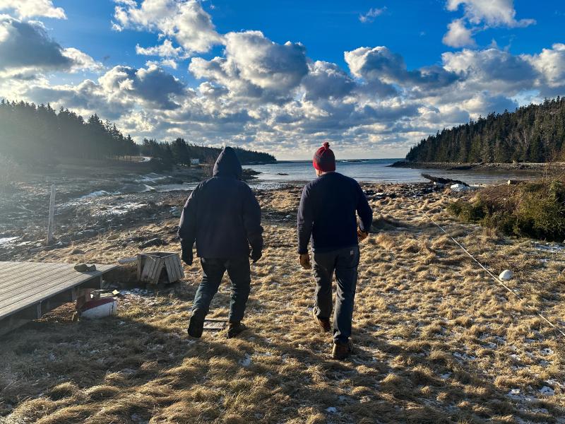 On Isle au Haut, from left to right, John DeWitt and the Mission’s Director of Island Services Douglas Cornman walk Head Harbor debris field. (Photo courtesy Maine Seacoast Mission)