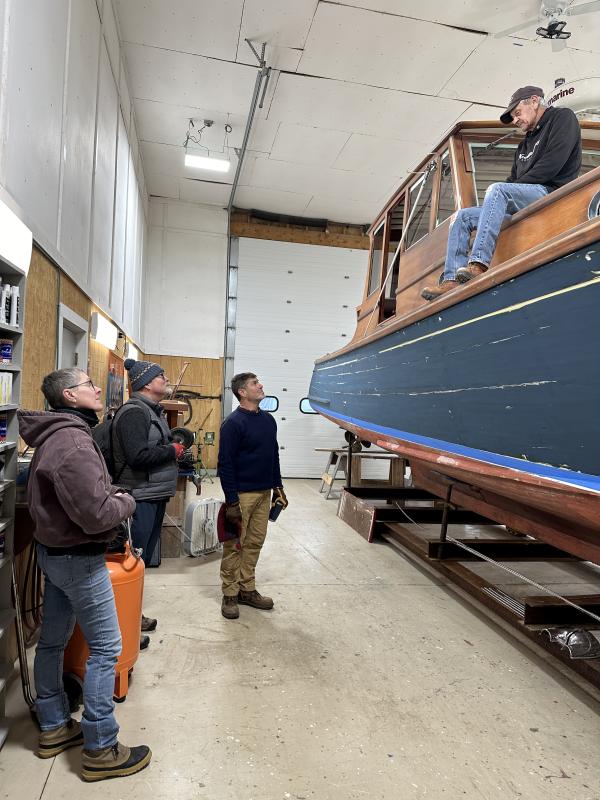Mission staff Stephanie Welch, Mission President John Zavodny, and Director of Island Services Douglas Cornman speak with an island resident following January storms. (Photo courtesy Maine Seacoast Mission)