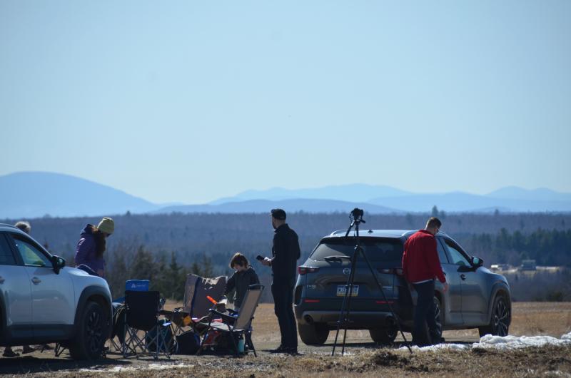 April 8, 2024, eclipse in Benedicta, Maine. People came from everywhere, and their car plates ranged from Texas to Florida to Connecticut, Mass. and Rhode Island. And, of course, Maine. (Photo by Lynda Clancy)
