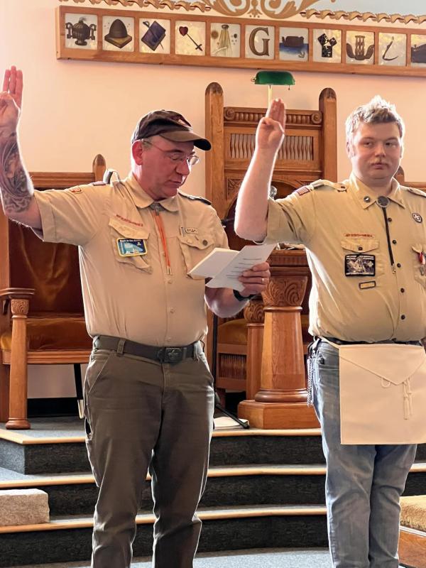 Troop 200 Scoutmaster Ed Weber leads James in the Eagle Scout Charge during James' Eagle Scout ceremony. (Photo courtesy Chuck Mahaleris)