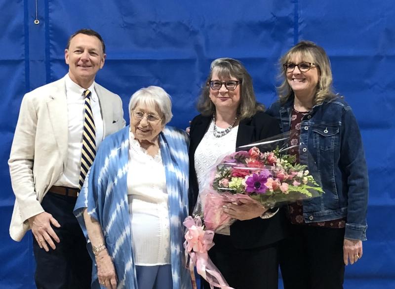 MVHS Principal Linda Pease (second from right, holding flowers) poses with family and friends after the all school assembly where she was named Maine’s 2024 Principal of the Year by the Maine Principals Association in Waldoboro on April 26. (Photo by Sarah Masters) MVHS, Linda Pease