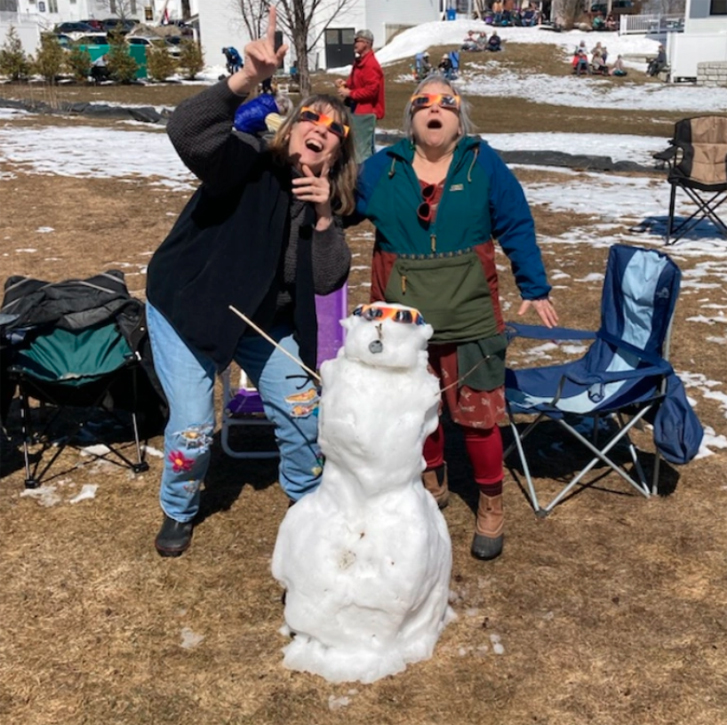 In Monson, Thomaston resident Dagney Ernest (on the right) watches with a congenial crowd, including a science teacher: “He shouted out ‘First Contact!!!’ when it started and we all whooped. (Photo courtesy Dagney Ernest)