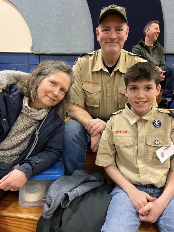 Benjamin Tepelmann and his parents, of Camden, cheer on the racers from Pack 200 during the Pinewood Derby held in Vassalboro. (Photo courtesy Chuck Mahaleris)