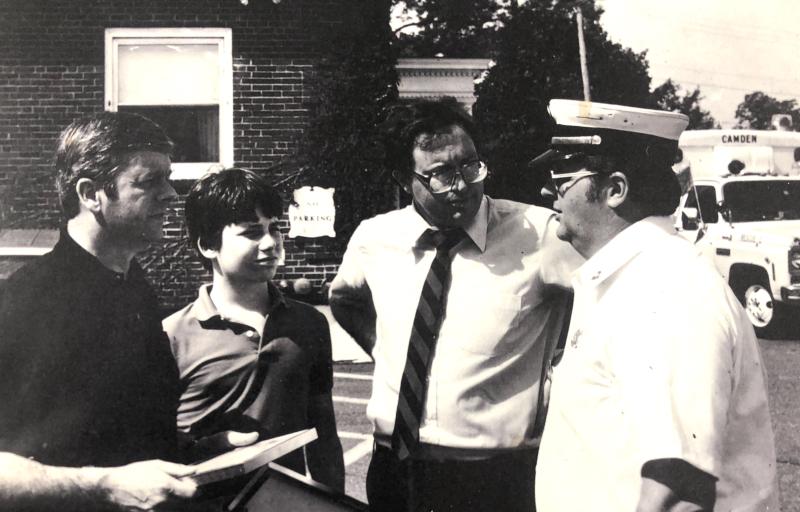 Fire Chief Robert Oxton talks with Maine Gov. Joe Brennan (far left), with one of Camden’s ambulances in the background. (Photo courtesy Walsh History Center/Camden Public Library) Camden ambulance