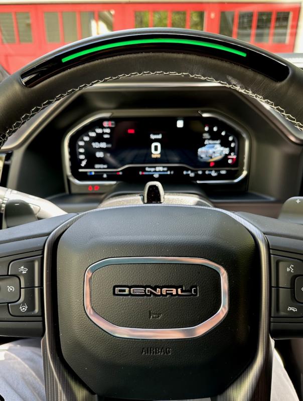 The light bar in the top of the wheel is linked to an infrared camera that monitors the driver’s eyes. If they’re looking straight ahead, the light is green and the Super Cruise system will be enabled.