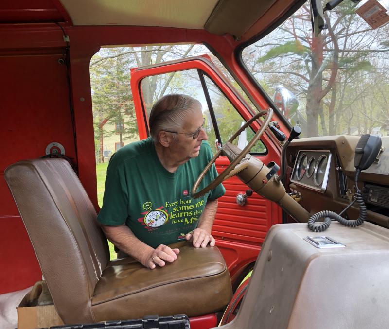 Camden’s retired Fire Chief Robert Oxton checks the mileage (46,000) on the 1972 Chevrolet van, one of Camden’s former ambulances. It is still in service for the town. (Photo by Lynda Clancy) Camden ambulance