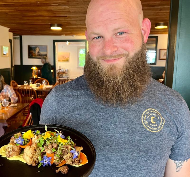 Gil Plaster, chef at The Causeway at the Craignair Inn, with the Spruce Head restaurant’s July “Into the Light!” selection of Roasted Cauliflower with Curry Aioli. (Photo by Patrisha McLean)