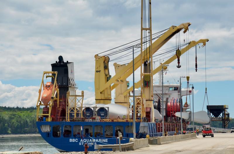Land-based wind turbines are offloaded June 11 from a Canadian ship that transported the cargo to Searsport from India. (Photo by Lynda Clancy)