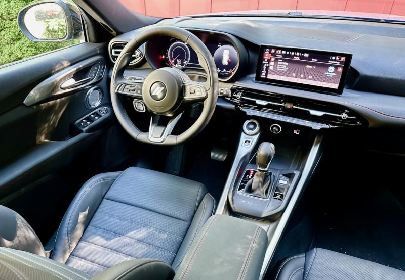 Our Hornet GT’s dour black-on-black cabin looks low-rent but closer inspection reveals features everywhere, including power-adjustable front seats and dual-zone automatic HVAC. The PowerShot button is in the lower left quadrant of the steering wheel.