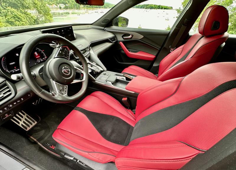 Red leather? In a Honda product? These sport seats are part of the top-trim Type S’s dynamic balance—supportive and purposeful, but highly adjustable and all-day comfortable. The bar on the console is a wrist rest for the driver’s hand while fiddling with the computer touchpad just ahead of it. Barely visible on the console behind the steering wheel rim is the drive-mode selector knob.