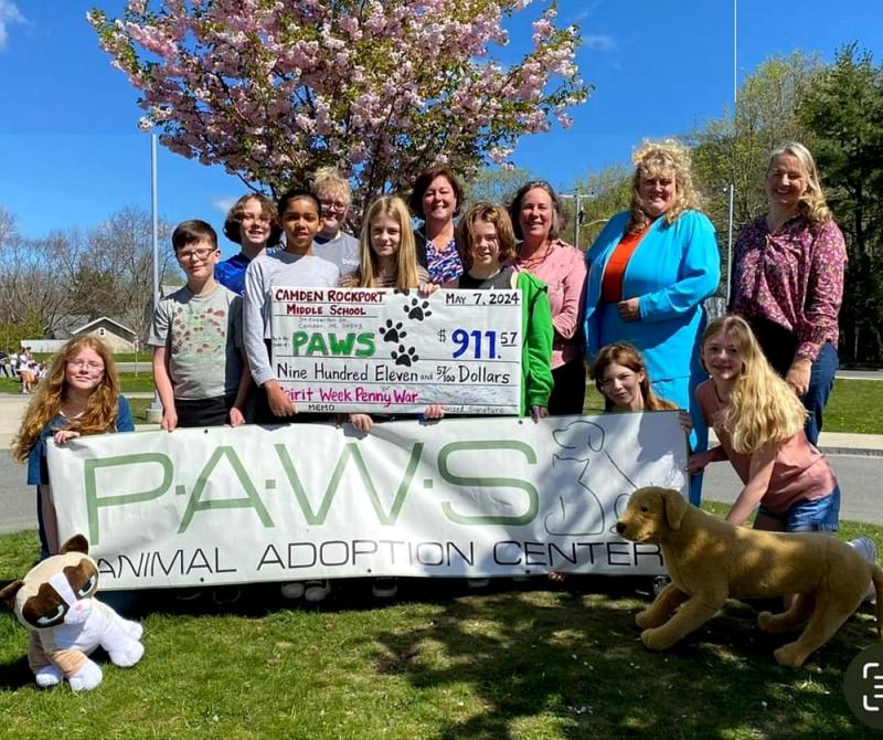 Left to right: Madilynn Lusca, Thomas Kunkel, George Johns, Adassa Palmer, Allison Parker, PAWS staff; Casey Belcher; Jaime Stone, CRMS Principal; Reverie Dyer; Gretchen Kuhn, CRMS Nurse; Nikole Seeger, CRMS Assistant Principal, Layla Novacek, Aria Madeira; and Gwendolyn Hudson, PAWS staff (Photo by Marsha Norwood)