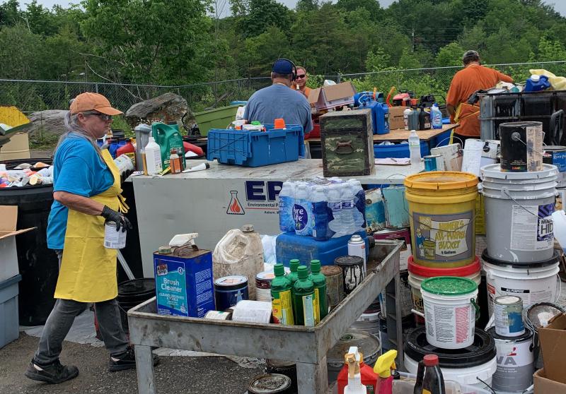 A crew from Environmental Projects, Inc., in Auburn, processes collected household hazardous waste, June 22, at the Mid-Coast Solid Waste Transfer Facility in Rockport. (Photo by Lynda Clancy)