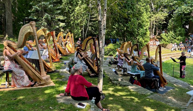 The Salzedo Harp Colony alumni ensemble grace the Camden Public Library Amphitheatre July 14 with a selection of music, including some original pieces by Carlos Salzedo. Conductor was Paula Page. (Photo by Lynda Clancy)