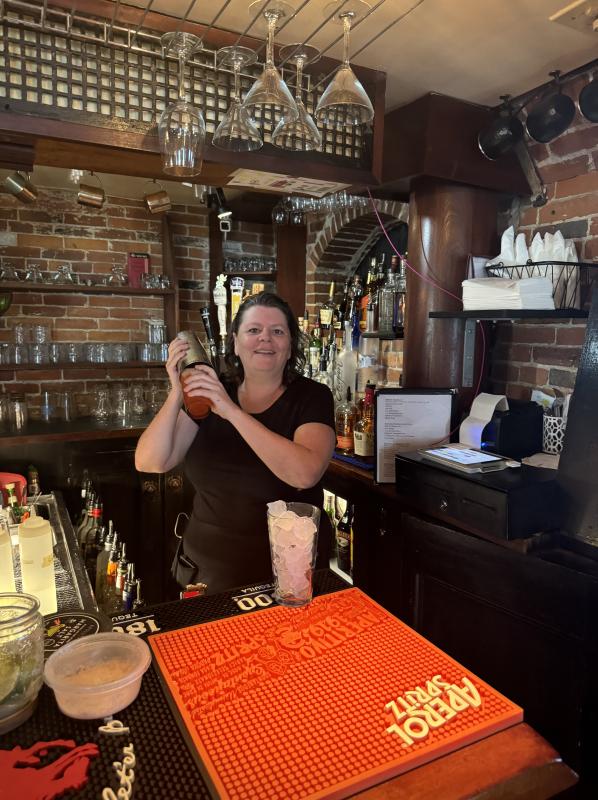 Dee whips up a serving of “Dee’s Punch” (Photo by Ed O’Brien)