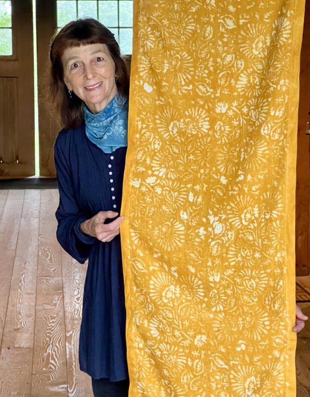 Antonia Munroe with her hand-stenciled linen table runner