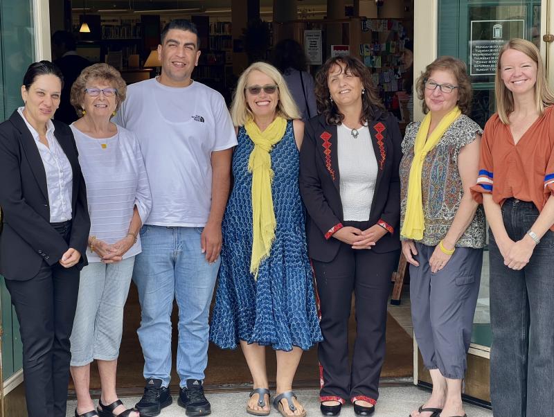 From left to right, Rateeba Abu Shosh, Mary Lou Smith, Montaser Abusharar, Patrisha McLean, Suheir Farraj, Mary Kamradt, and Kristy Kilfoyle, the executive director of the Camden Public Library which for two summers in a row has hosted the visit between Finding Our Voices and Middle East women’s rights activists. McLean said that exciting plans for continuing connection between the Palestinian territories and Maine include Palestinian women embroidering items for Finding Our Voices that echo the gorgeous red stitching on the outfit worn by Suheir Farraj, but in the Finding Our Voices signature color of yellow! (Photo courtesy Finding Our Voices)