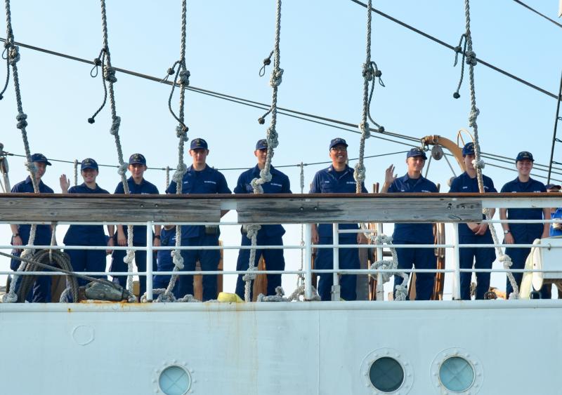 U.S. Coast Guard Barque Eagle cadets line to decks Aug. 2 to welcome visitors aboard the ship. (Photo by Lynda Clancy)