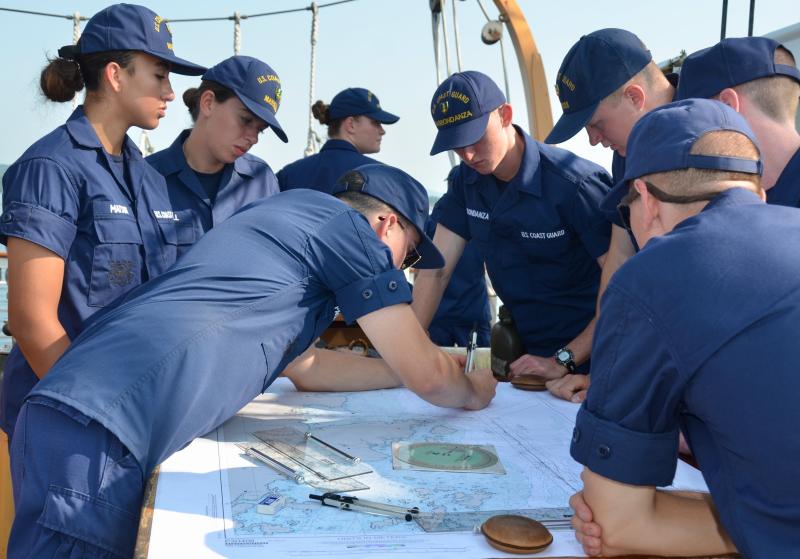 Foundational training aboard the Eagle includes learning how to chart courses and understand, as well as employ, navigation skills. From left to right: U.S. Coast Guard Cutter Eagle (WIX 327) crewmember Ensign Michael Pagan-Selby, U.S. Coast Guard Academy Cadet 4th Class Select Delia Massell, U.S. Coast Guard Academy Cadet 4th Class Select Amelia Matson. (Photo by Lynda Clancy)