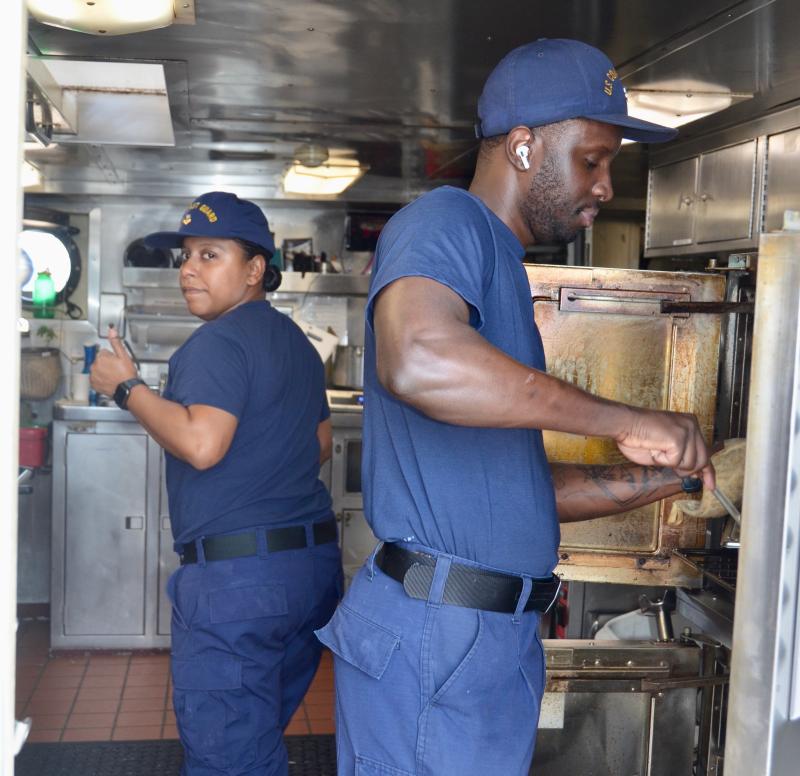 From left to right, U.S. Coast Guard Cutter Eagle (WIX 327) Culinary Specialists 2nd Class Fallon Ferguson and Kenlee Mars. (Photo by Lynda Clancy)
