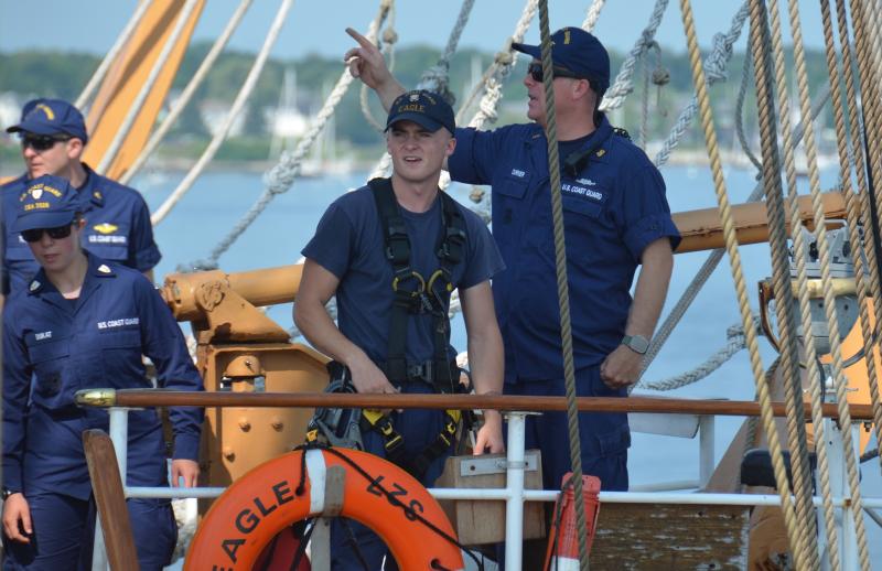 Chief Bosun Lee Currier, at the right, is in charge of the Eagle. He is the sail master and is in charge of everything to do with sailing, and sailing is one of the primary objectives of the Eagle. (Photo by Lynda Clancy)