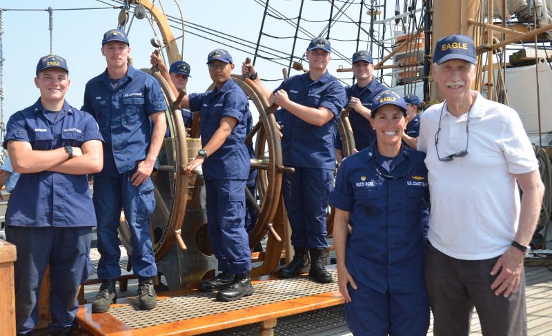 U.S. Coast Guard Academy cadets and Eagle crew members help steer the Eagle into Rockland Harbor, Aug. 2. There are four Coast Guard Academy cadet fourth class selects, and two Eagle crew members behind Captain Jessica Rozzi-Ochs and Maine’s U.S. Senator Angus King. (Photo by Lynda Clancy)