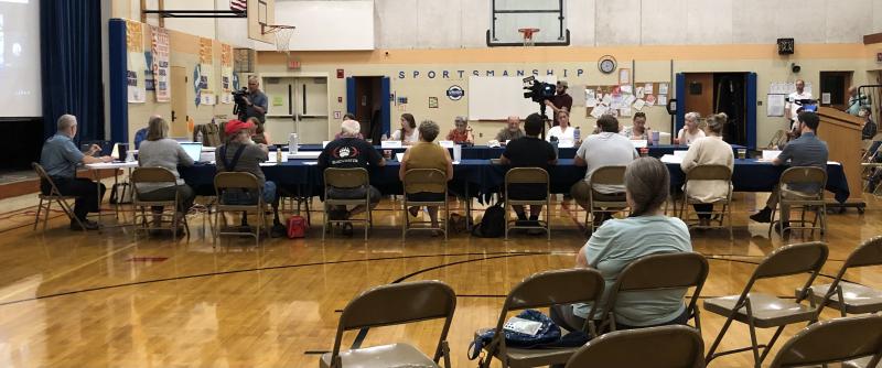 The RSU40 School Board debates whether to re-instate a policy which provides guidelines for how staff interact with children who identify as transgender and/or gender expansive on Aug. 1 in the Union Elementary School gymnasium. (Sarah Masters photo)