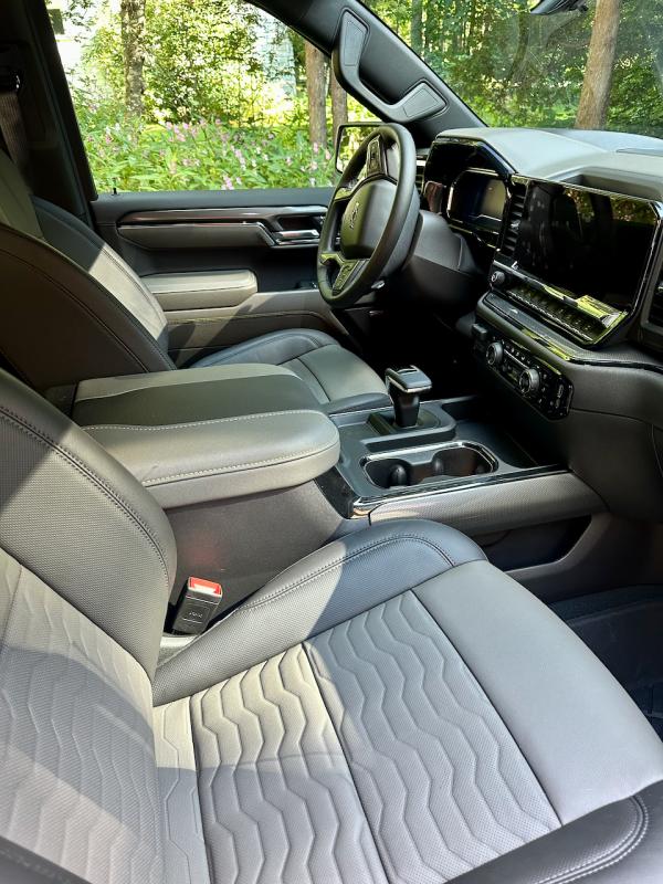 The Silverado ZR2 cab is roomy and relatively quiet, and the electrically adjustable front seats are all-day comfortable. The P-for-park switch is set into the top of the T-handle shift lever; be careful not to engage it accidentally.
