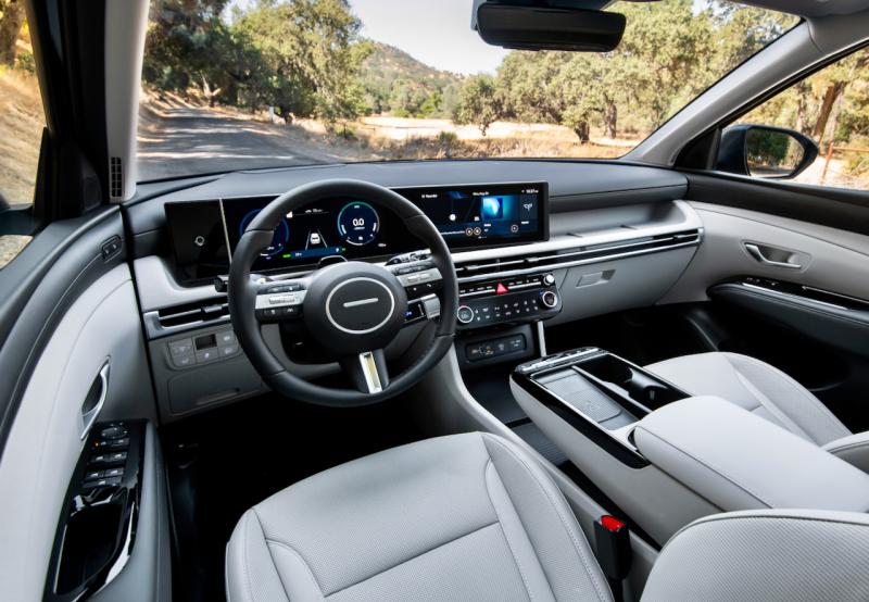 The handsome new-for-‘25 panoramic dashboard is curved toward the driver and features crisp digital displays and intuitive controls. The new center stack below it has real knobs and buttons for manual adjustment of often-used functions, including the audio and HVAC systems. Note also the new storage shelf above the glove box. Tucson car