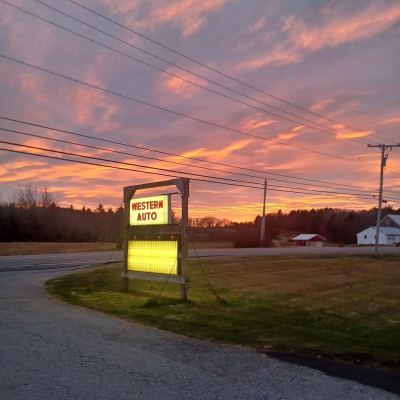 The sun sets over the last Western Auto in the country. (Photo by Sam Gaudette) Sunset