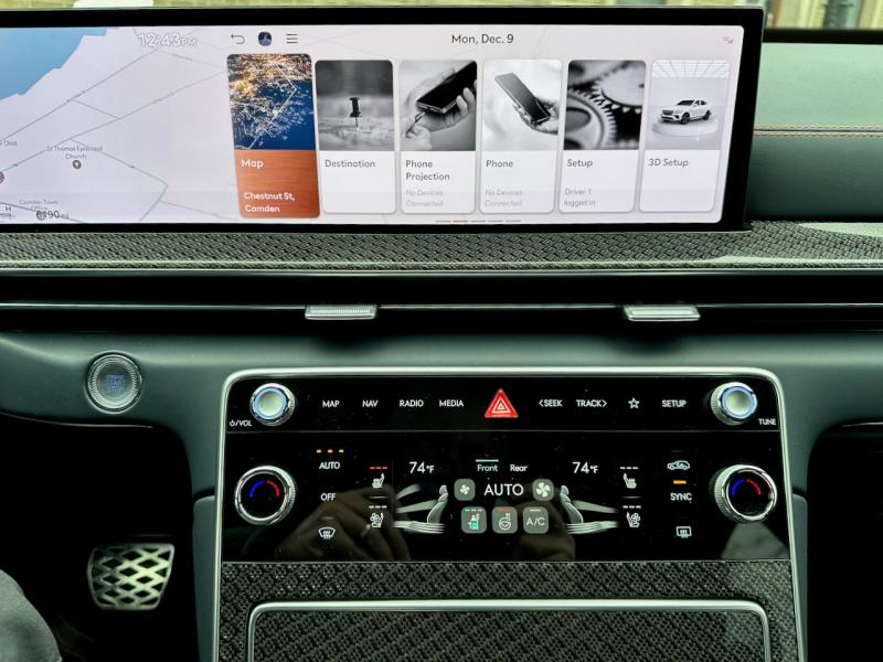 Computer menus are accessible by touch or via the joystick. Every function is explained clearly—some in color, some in artistic black & white—and in type legible even to drivers who otherwise need reading glasses. Often-used controls are manual knobs and buttons available on the console and on the steering wheel. GV80 screen