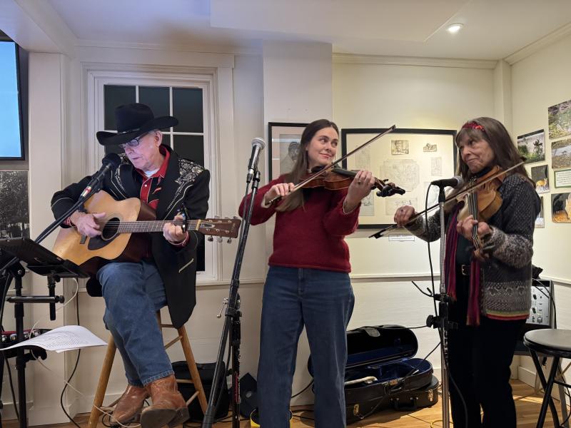 Rosey, Corrine, and Lise play traditional Christmas music. Music