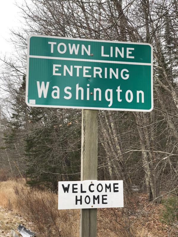 Welcome Home, Washington (Sarah Masters photo) DOT Washington Sign Town Line Sign with Welcome Home sign posted under it