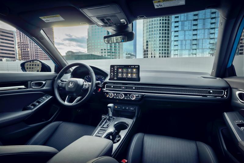 The front office of the Civic manages to be both compact and spacious, with attractive honeycomb and carbon fiber-look panels. The infotainment screen offers haptic feedback—the touchpads move slightly—but there are conventional switches and knobs on the console too. Honda Civic Interior