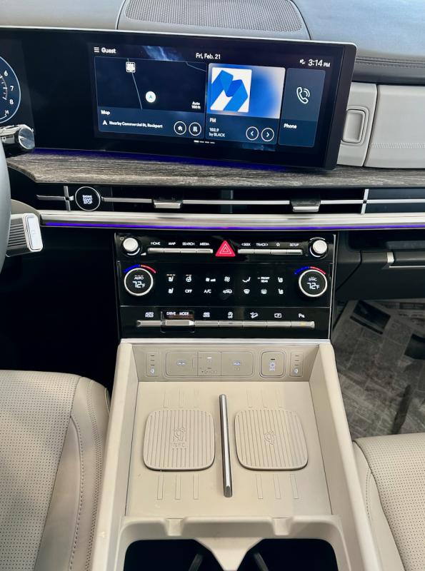 The re-designed-for-2024 Santa Fe’s instrument panel is curved toward the driver and incorporates the 12.3-inch-diagonal central touchscreen, which is equipped with apps galore. Note the manual controls for often-used functions, including the two-zone climate control, the available dual phone chargers and all the electrical plugs as well as two-stage steering-wheel heat and three-stage seat heat. Under this console is a capacious pass-through storage cubby. The re-designed-for-2024 Santa Fe’s instrument panel is curved toward the driver and incorporates the 12.3-inch-diagonal central touchscreen, which is equipped with apps galore. Note the manual controls for often-used functions, including the two-zone climate control, the available dual phone chargers and all the electrical plugs as well as two-stage steering-wheel heat and three-stage seat heat. Under this console is a capacious pass-through storage cubby.
