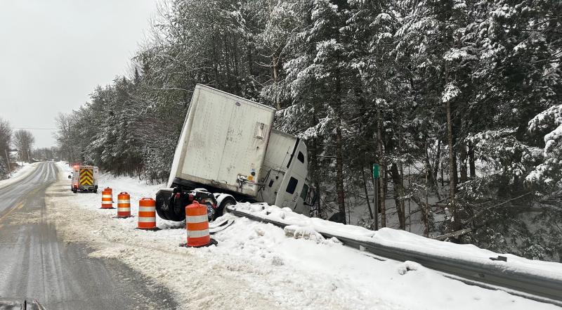 A tractor-trailer jackknifed on Route 17 in Washington early in the afternoon, Feb. 27, after the driver slipped off the snow-covered highway and collided with a guard rail. The crash occurred in the eastbound lane, just west of the Vanner Road intersection in Washington.
Tractor trailer went off the road and is hanging off of the guardrail in the eastbound lane of RT 17. It is on the flat stretch at the bottom of the hill, just west of Vanner Road.
The trailer is in the ditch and the truck is jackknifed on top of the guardrail.
Route 17 crash