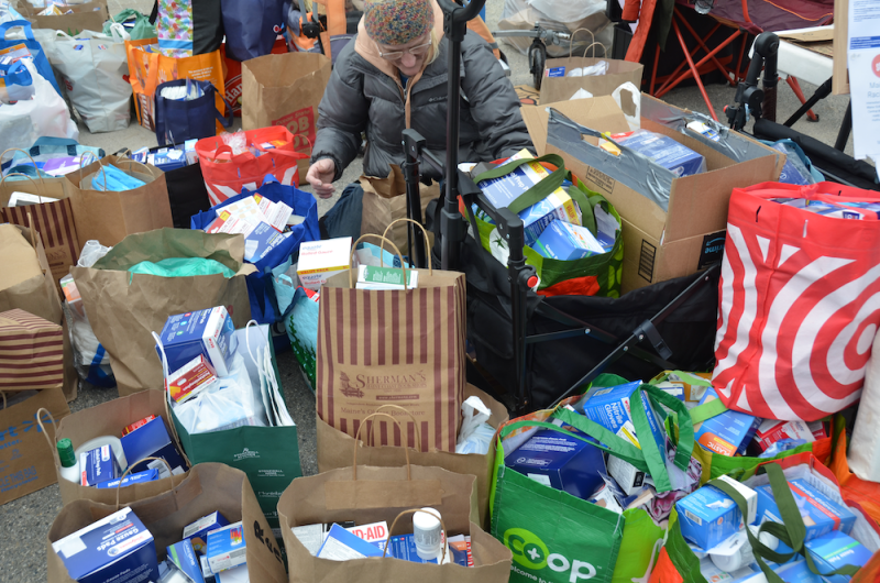 First aid kits collected to be sent Down East, where immigrants are in need of supplies because they are afraid to leave their houses to go to the emergency departments at hospitals or to urgent care, or to go to the store to buy bandaids and Tylenol. (Photo by Lynda Clancy) c