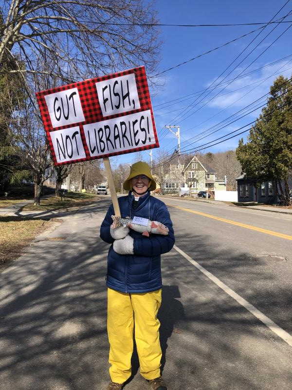 Creatively costumed protestor at the Waldoboro Library decried Federal funding cuts impacting libraries. (Sarah Masters photo) c