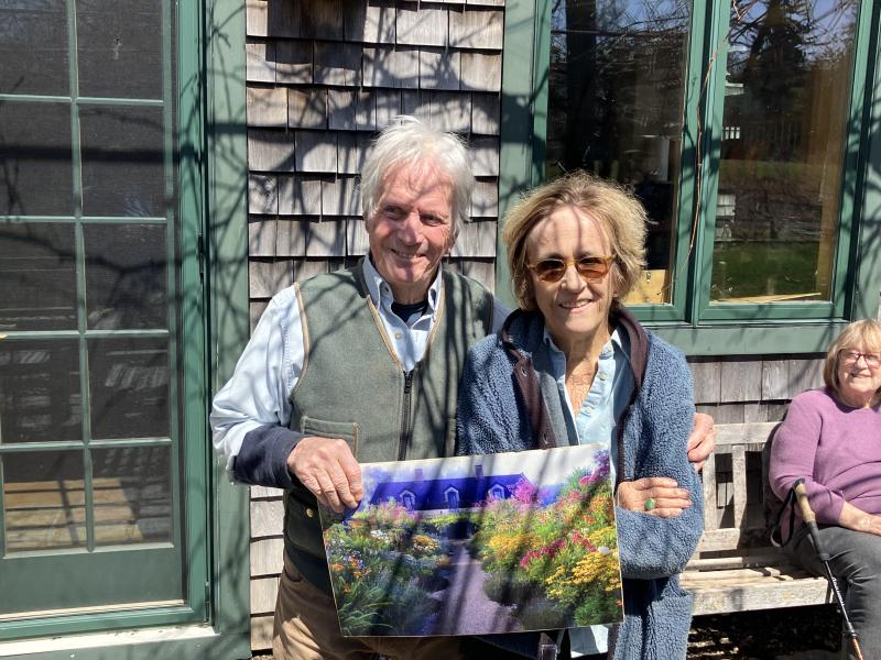 Barbara Damrosch and Elliot Coleman Welcoming Camden Garden Club-Nancy Harmon Jenkins Approves Barbara and Elliot are holding a painting of the garden in high season.