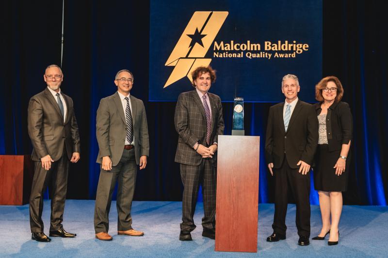 L-R: Robert Fangmeyer, Director, Baldrige Performance Excellence Program; Eric Lin, Acting Associate Director for Innovation and Industry Services, National Institute of Standards and Technology, Department of Commerce; Tom Raffio, President and CEO, Northeast Delta Dental; Brian Townsend, Chair, DDVT Board of Trustees; Kathryn Eggleston, Chair, Foundation for the Malcolm Baldrige National Quality Award. (Photo by Hamilton Photography) L-R: Robert Fangmeyer, Director, Baldrige Performance Excellence Program; Eric Lin, Acting Associate Director for Innovation and Industry Services, National Institute of Standards and Technology, Department of Commerce; Tom Raffio, President and CEO, Northeast Delta Dental; Brian Townsend, Chair, DDVT Board of Trustees; Kathryn Eggleston, Chair, Foundation for the Malcolm Baldrige National Quality Award. (Photo by Hamilton Photography)