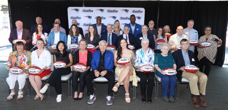 Patriots Chairman and CEO Robert Kraft, Patriots Executive Director of Community Affairs Andre Tippett and Procter & Gamble’s VP of Communications & Community Affairs, Global Grooming, Kara Buckley take a group photo with the 2025 Myra Kraft Community MVP Award winners at Gillette Stadium. (Photo courtesy Eric J. Adler/New England Patriots) Patriots Chairman and CEO Robert Kraft, Patriots Executive Director of Community Affairs Andre Tippett and Procter & Gamble’s VP of Communications & Community Affairs, Global Grooming, Kara Buckley take a group photo with the 2025 Myra Kraft Community MVP Award winners at Gillette Stadium. (Photo courtesy Eric J. Adler/New England Patriots)
