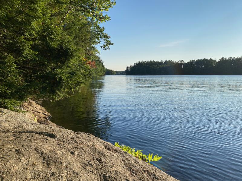 View of a river as seen from a boulder shoreline