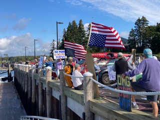 Demonstrators line the Port Clyde Public Landing to protest rulings by U.S. Supreme Court Chief Justice Roberts. (Photo courtesy Nancy Button) Demonstrators line the Port Clyde Public Landing. (Photo courtesy Nancy Button)